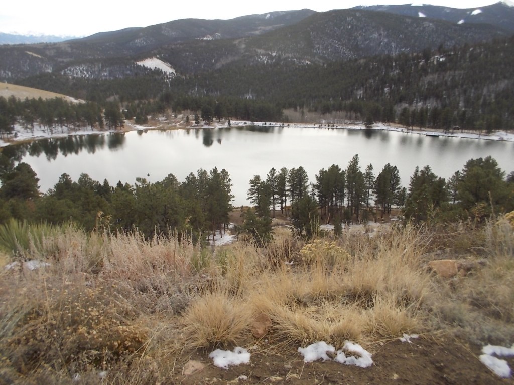 Mountain lake with tiny boat