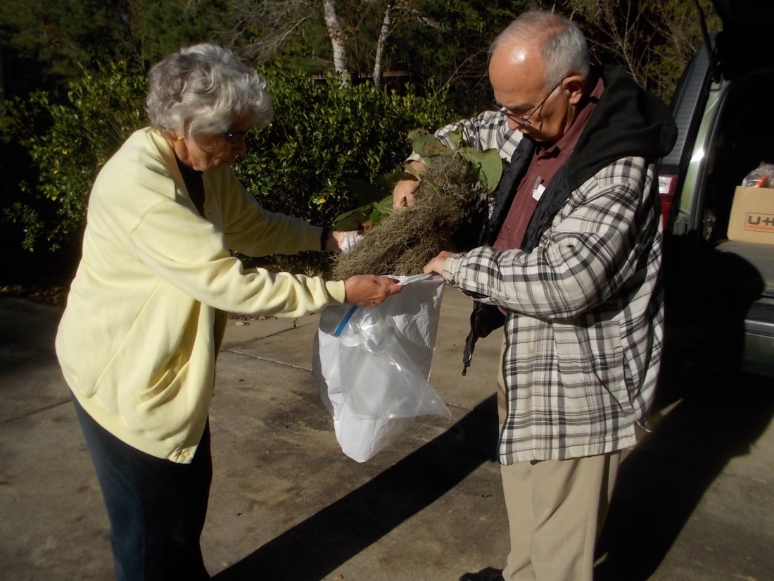 Chris holds the bag for John