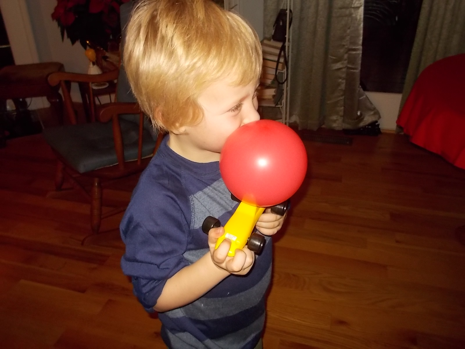122815 Logan blows balloon for car.JPG