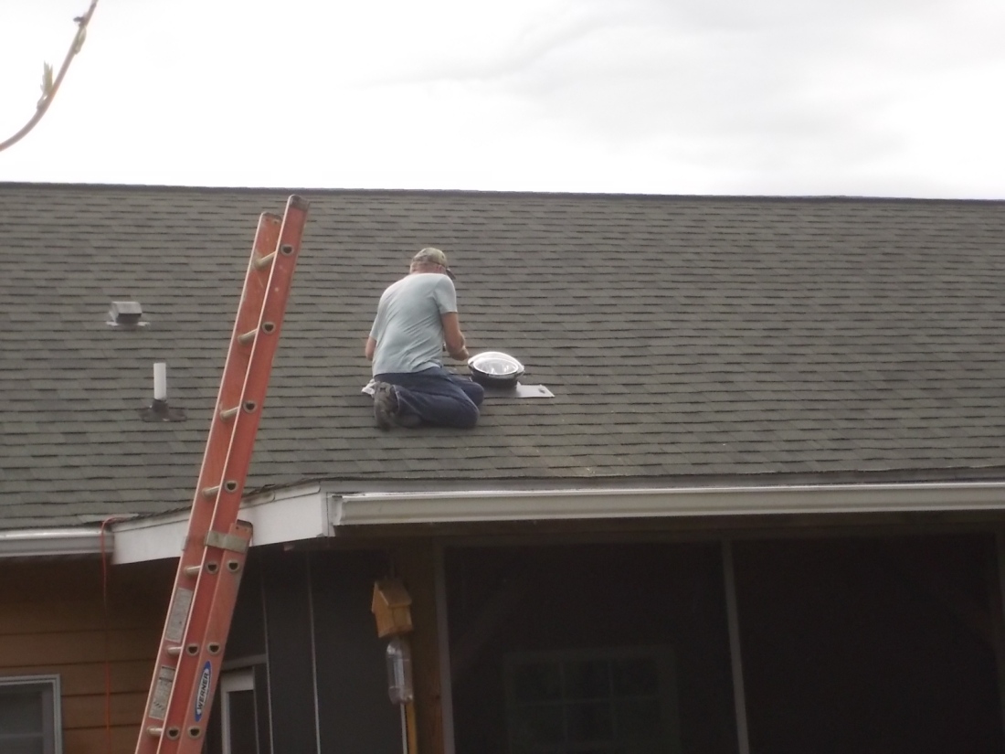 051616 Bob finishing solar tube on roof.JPG