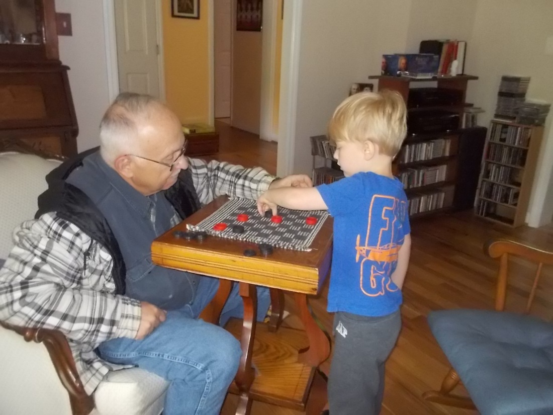 051616 John and Logan play checkers.JPG