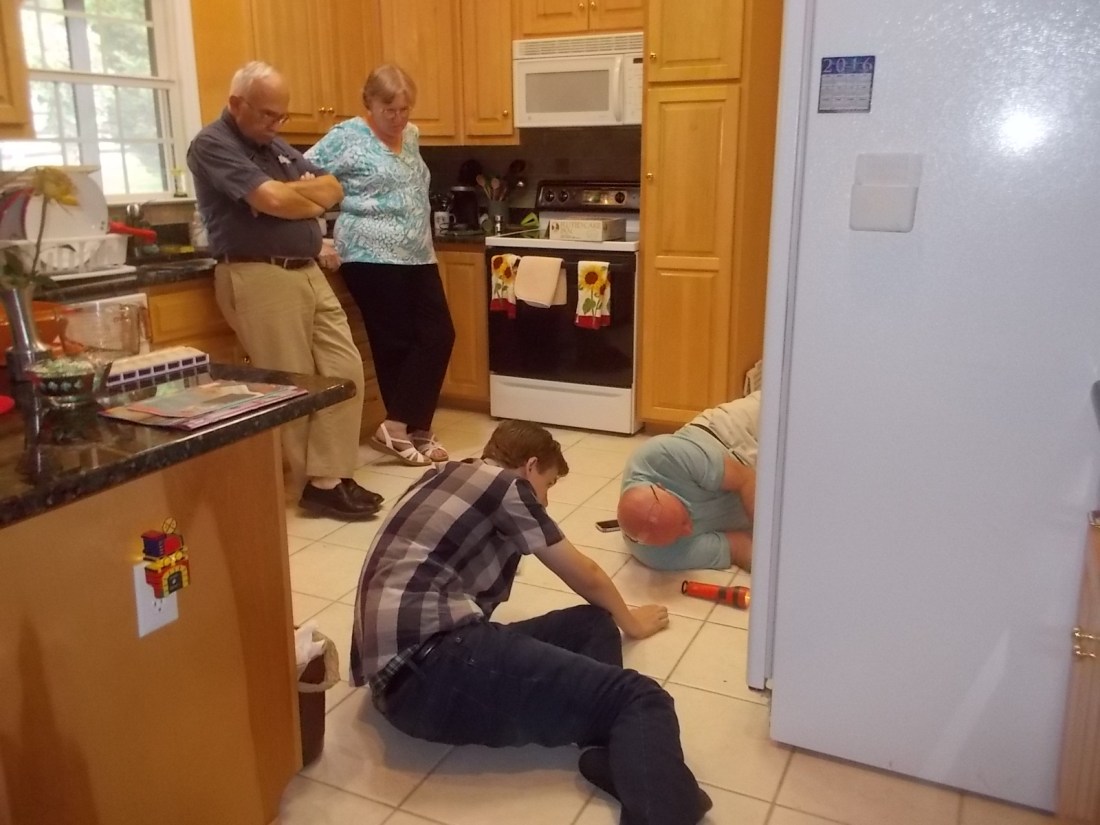 080616 Fridge repairers and two supervisors.jpg