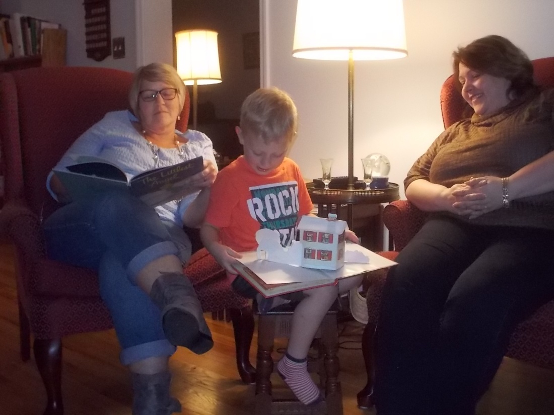 112916 Logan reads Night Before Xmas to Shawn and Lise.JPG