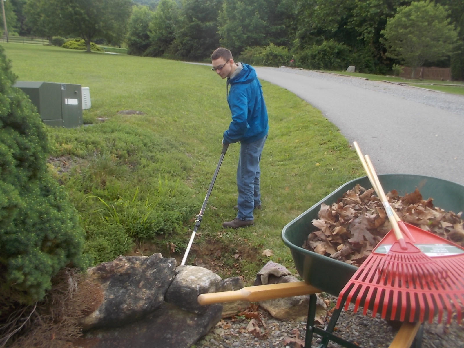 060817 David cleans driveway pipe.JPG