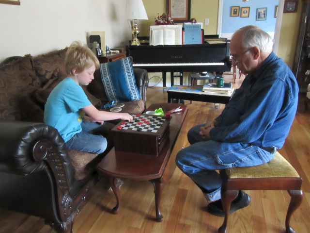 032118 (3) Logan plays checkers with John.JPG