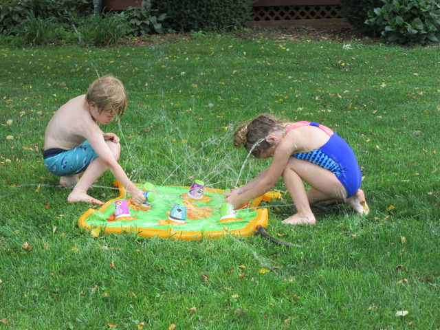 062018 Logan and Lily play with water mat.JPG