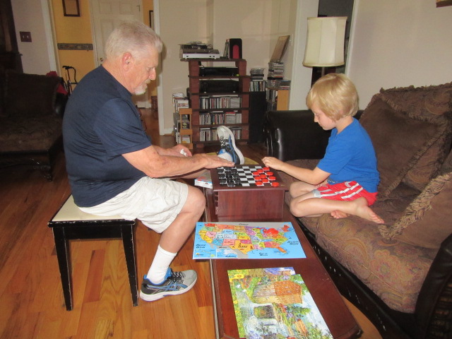 070418 Ron plays checkers with Logan.jpg