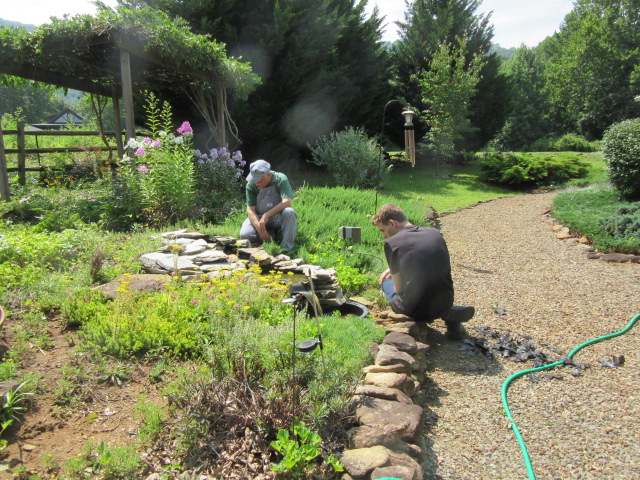 071118 First repairs to backyard waterfall.JPG