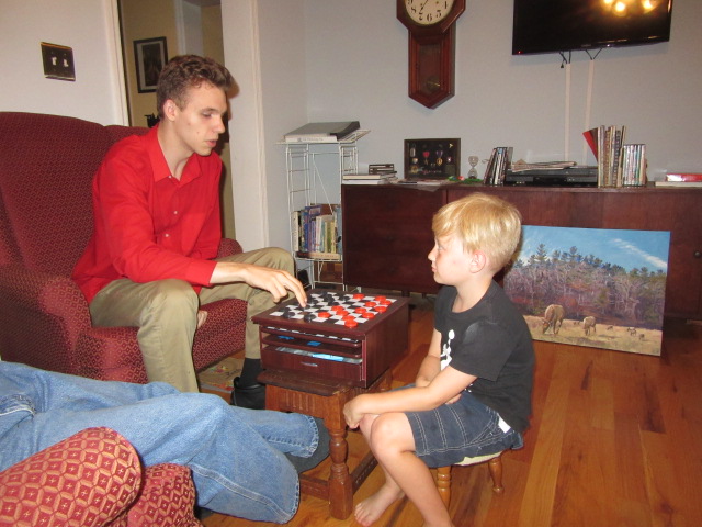 072318 N plays checkers with Logan.JPG