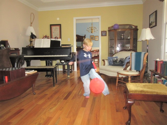 110618 Logan is a blur playing balloon.JPG