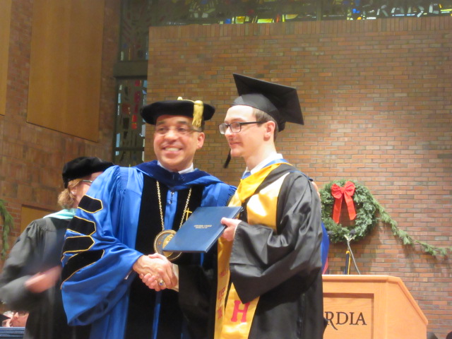 121618 David graduates  (7) Dr Nunes poses with David.JPG